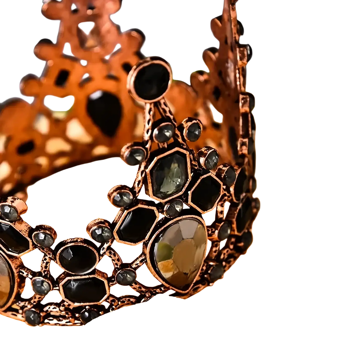 Mini crown cake topper and hair tiara in ornate copper tone with black and dark green faceted gemstones in hexagonal pattern