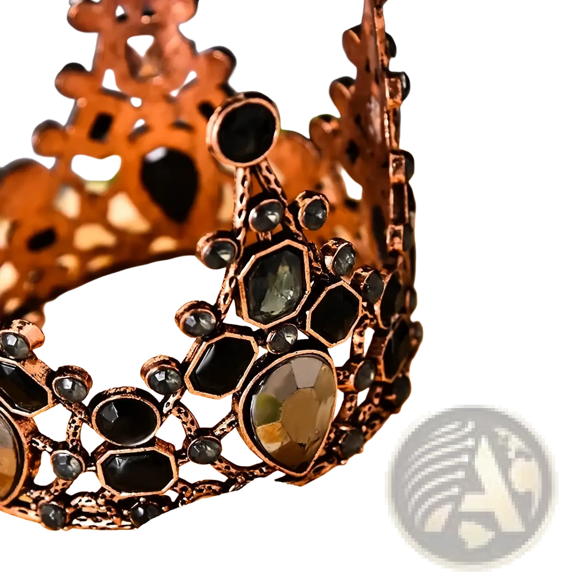 Mini crown cake topper and hair tiara in ornate copper tone with black and dark green faceted gemstones in hexagonal pattern