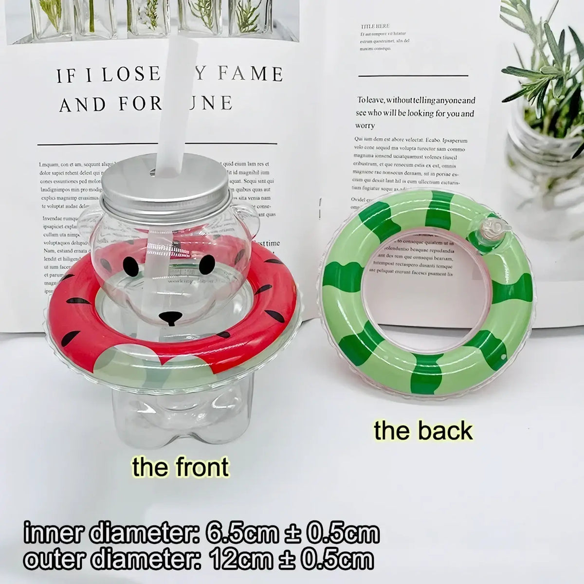 Clear glass bear-shaped water bottle with silver lid and straw featuring red and green striped watermelon float ring for mini doll swim set