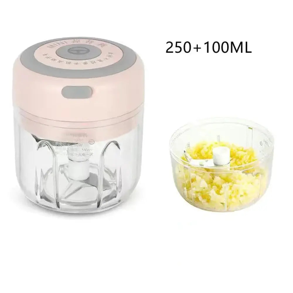 Usb electric mini food chopper and garlic mincer in pink and gray with a clear glass container for efficient chopping
