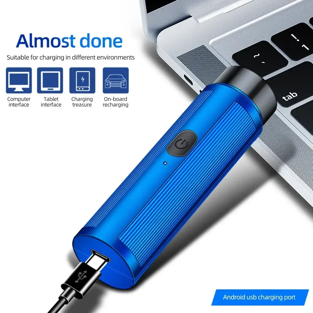 Blue metallic mini electric shaver with textured grip and black power button showing usb charging stick for quick charging time