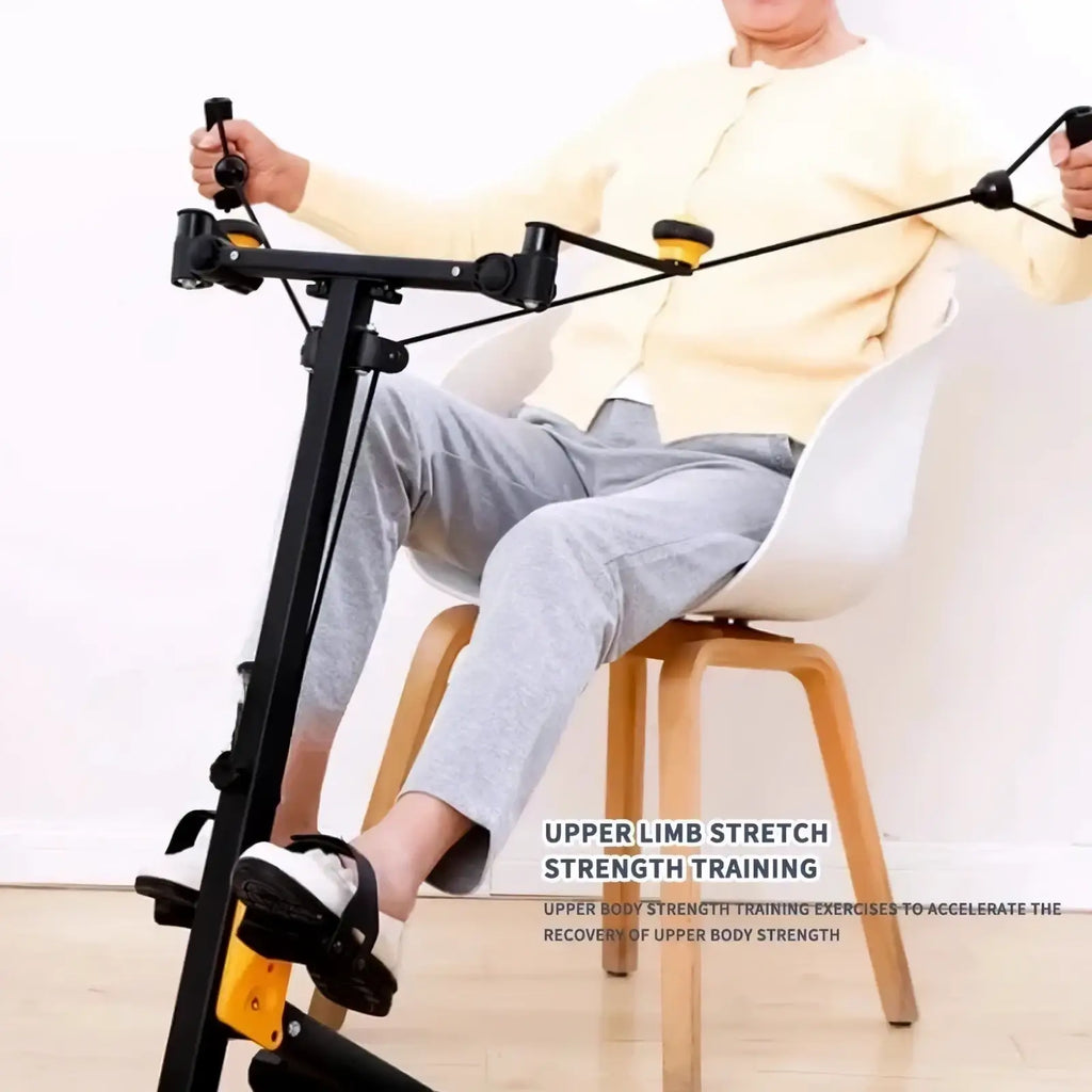 Black and yellow mini exercise bike upper and lower limb trainer with adjustable handles and foot pedals for strength training
