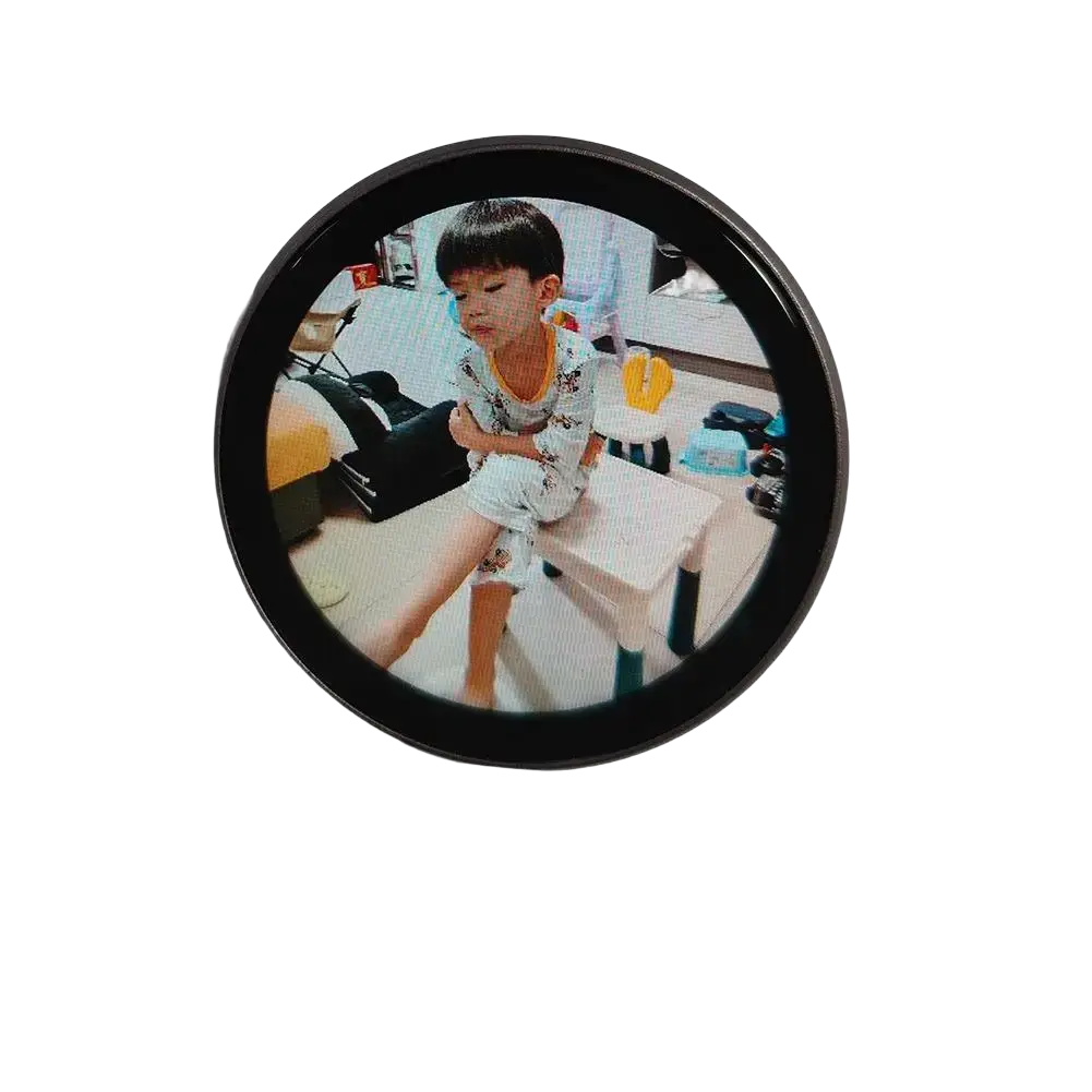Circular black-framed mini gadget mirror with 1-inch diameter showing young boy in pajamas includes data cable