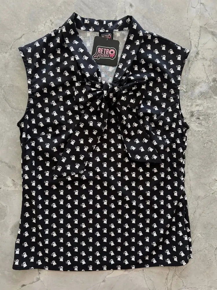 Black sleeveless blouse with white ghost pattern and tied bow neckline featuring Retro Lovers brand tag