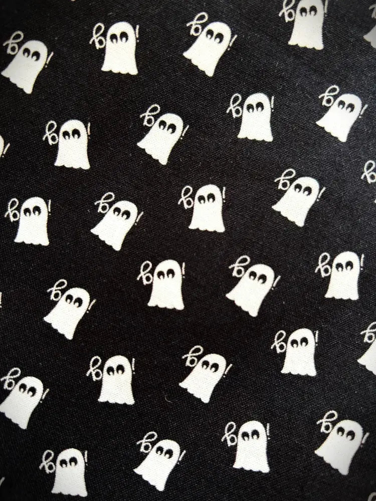 Black mini ghost high waisted pleated skater skirt with white cartoon ghosts and boo pattern on fabric