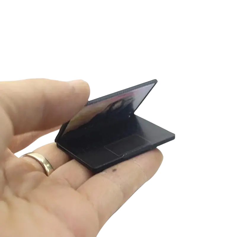 Black miniature alloy mini laptop with glossy finish and compact design for doll house accessory collection