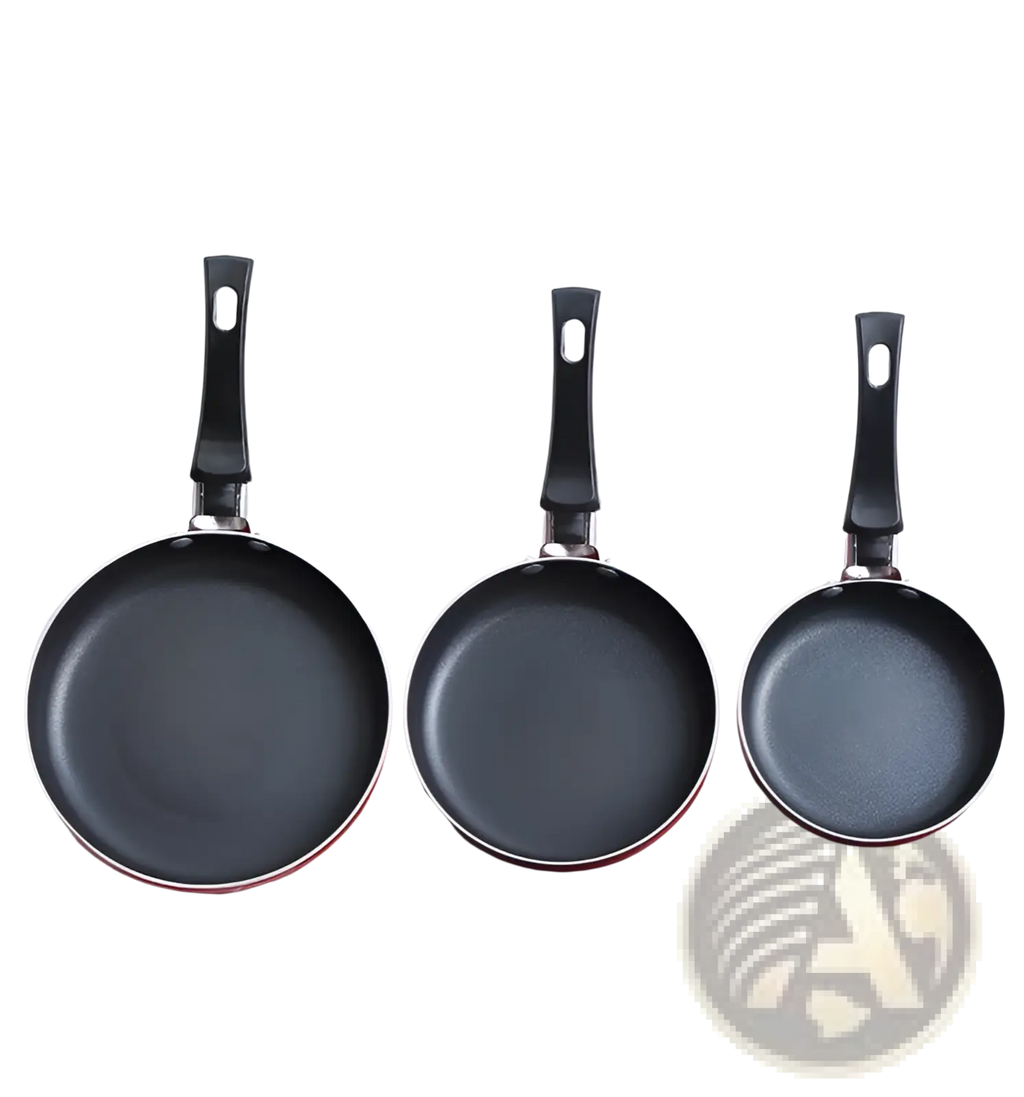Set of three black aluminum mini non-stick frying pans with red rims and ergonomic handles for cookware use
