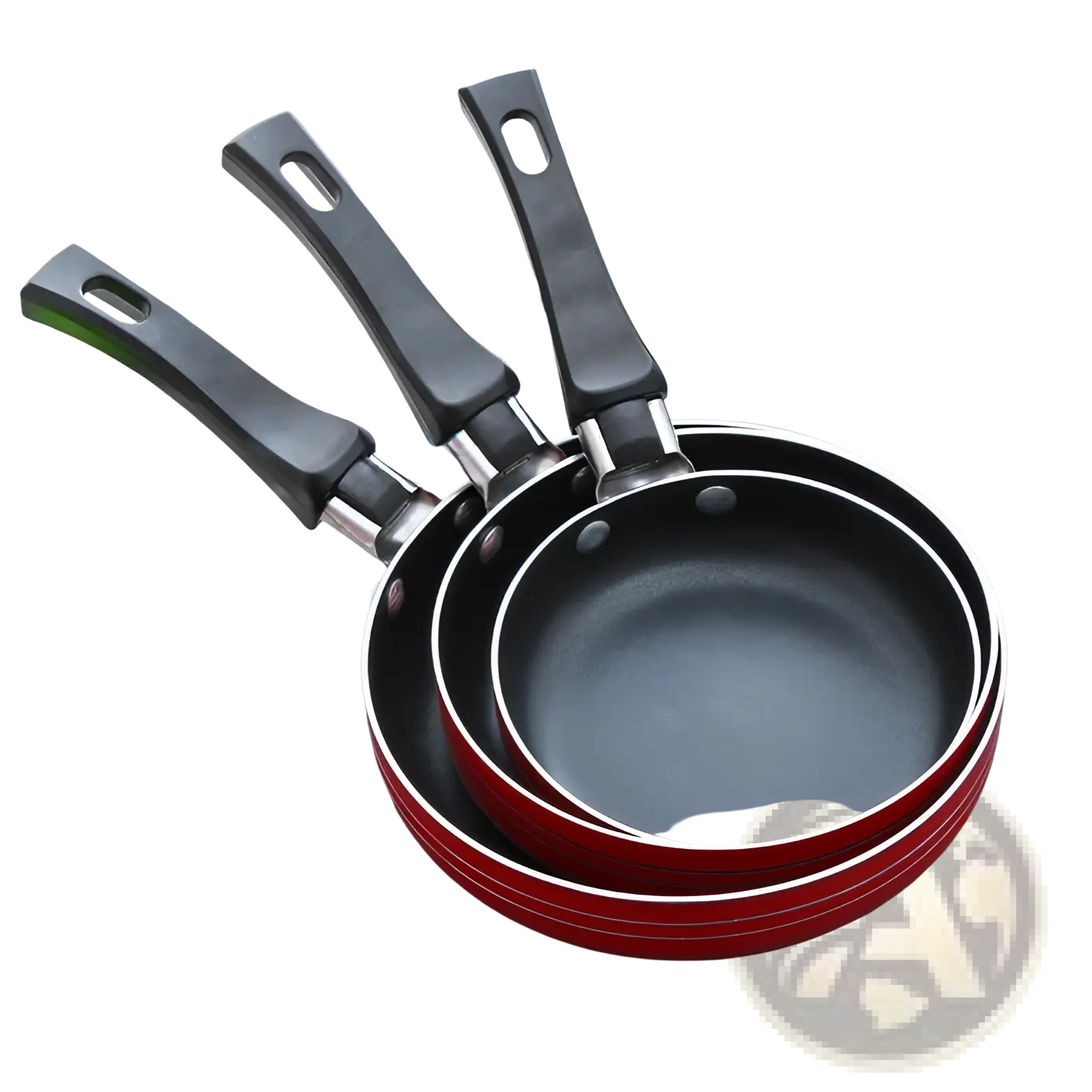 Set of three nested mini non-stick aluminum frying pans with black handles and red exteriors for cooking