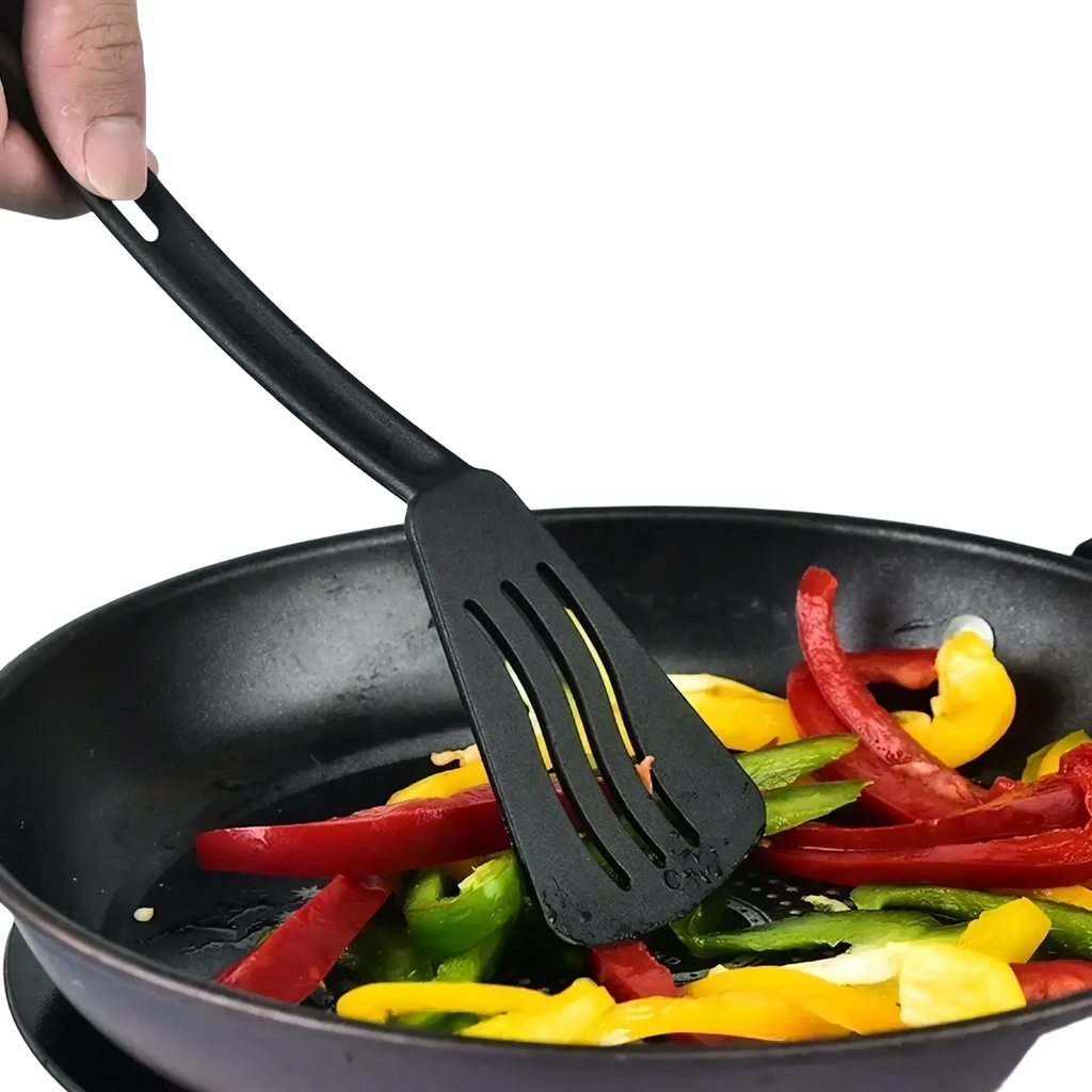 Black plastic slotted spatula with smooth handle and three slots from mini nylon camping utensil set
