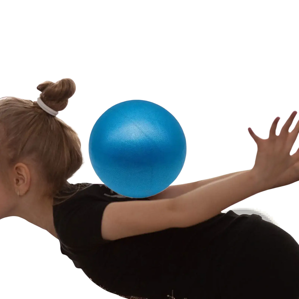 A vibrant blue mini pilates ball 15cm with smooth surface on a person’s shoulder for core stability exercise