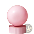A smooth matte-finish pink mini pilates exercise ball 25cm with explosion proof feature on a matching ribbed pedestal