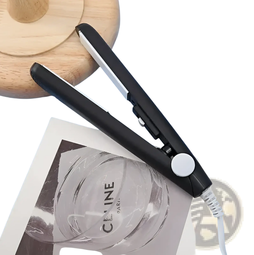 Mini portable ceramic hair straightener and curler in black and silver with a white power button