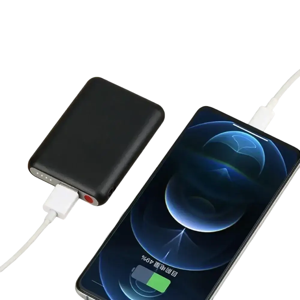 Black rectangular mini power bank 5000mah with white cable connected to smartphone for heated gloves battery use