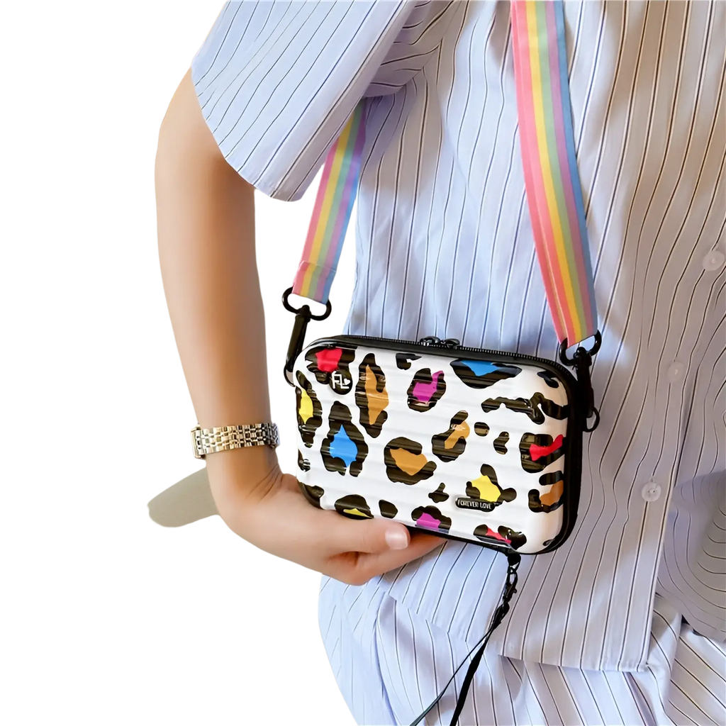 Mini suitcase crossbody bag with colorful leopard print, black trim, rainbow strap, and forever love brand logo