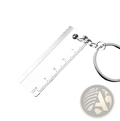 Silver metallic keychain ruler with serrated edge and engraved measurements in mini tool keychain set metal multi-tool