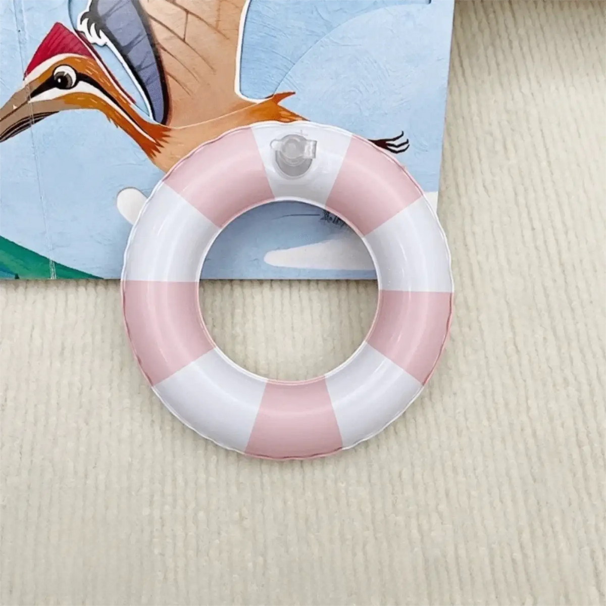 Mini Turtle inflatable swim ring aquarium toy in pink and white stripes with clear valve on top made of durable material
