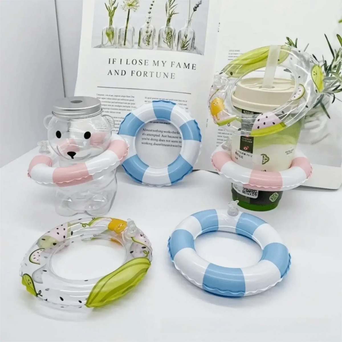 Clear plastic bear-shaped drink container with silver lid and pink inflatable ring in mini turtle swimming pool float design
