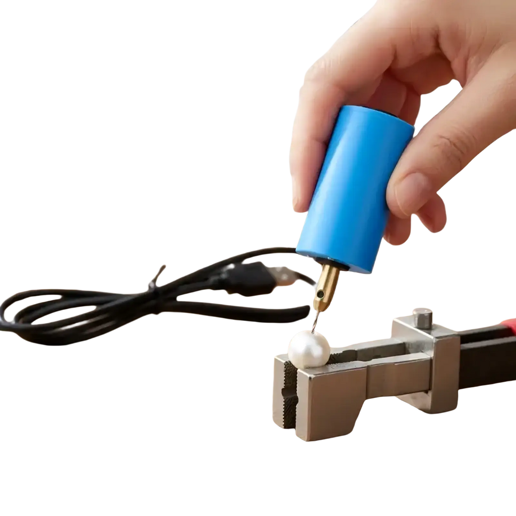 Blue mini usb electric hand drill with brass tip held over white pearl in metal vise for jewelry resin diy