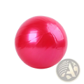 A shiny vibrant red mini yoga ball 20cm made of inflatable smooth glossy material for fitness balance exercise