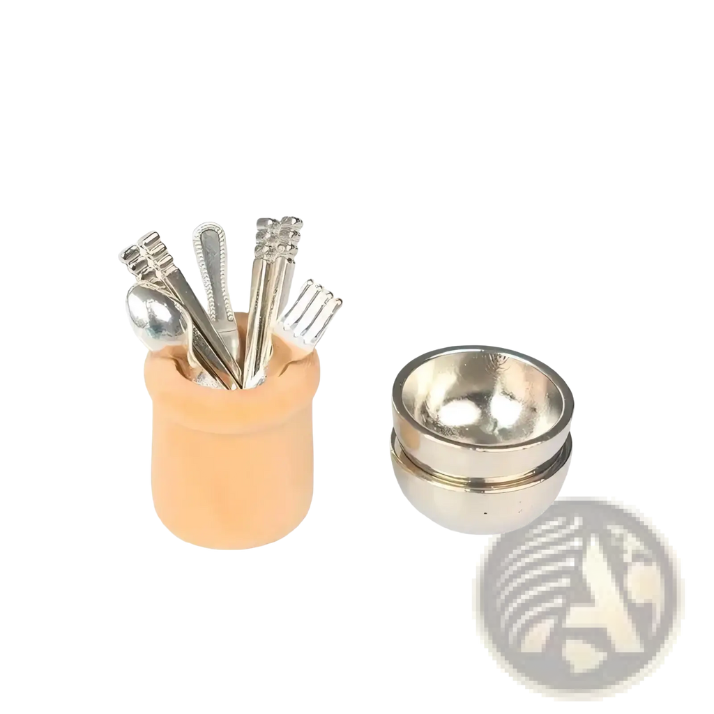 Miniature dollhouse kitchen utensil set with peach-colored ceramic holder, silver-toned cutlery, and stacked metallic bowls
