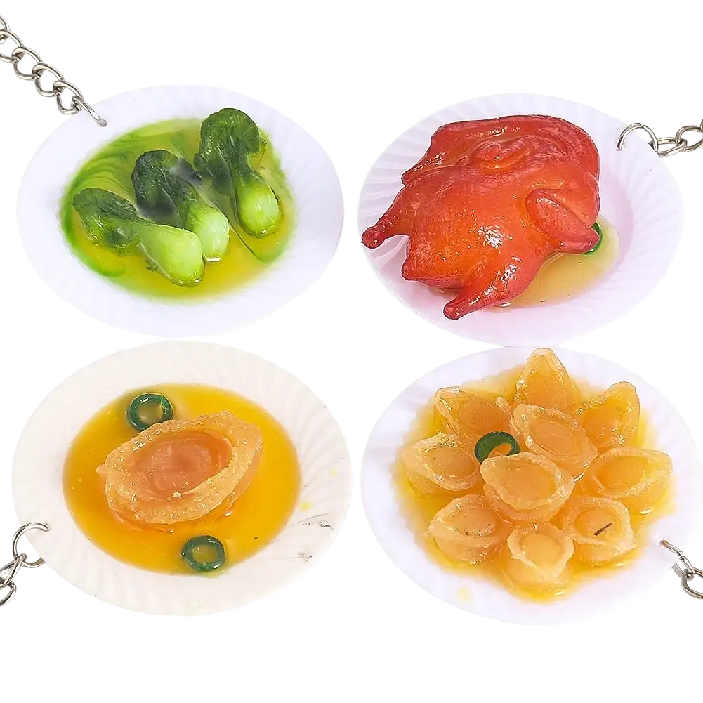 Miniature food keychain featuring a glossy realistic roasted chicken on a white plate with sauce simulation dish