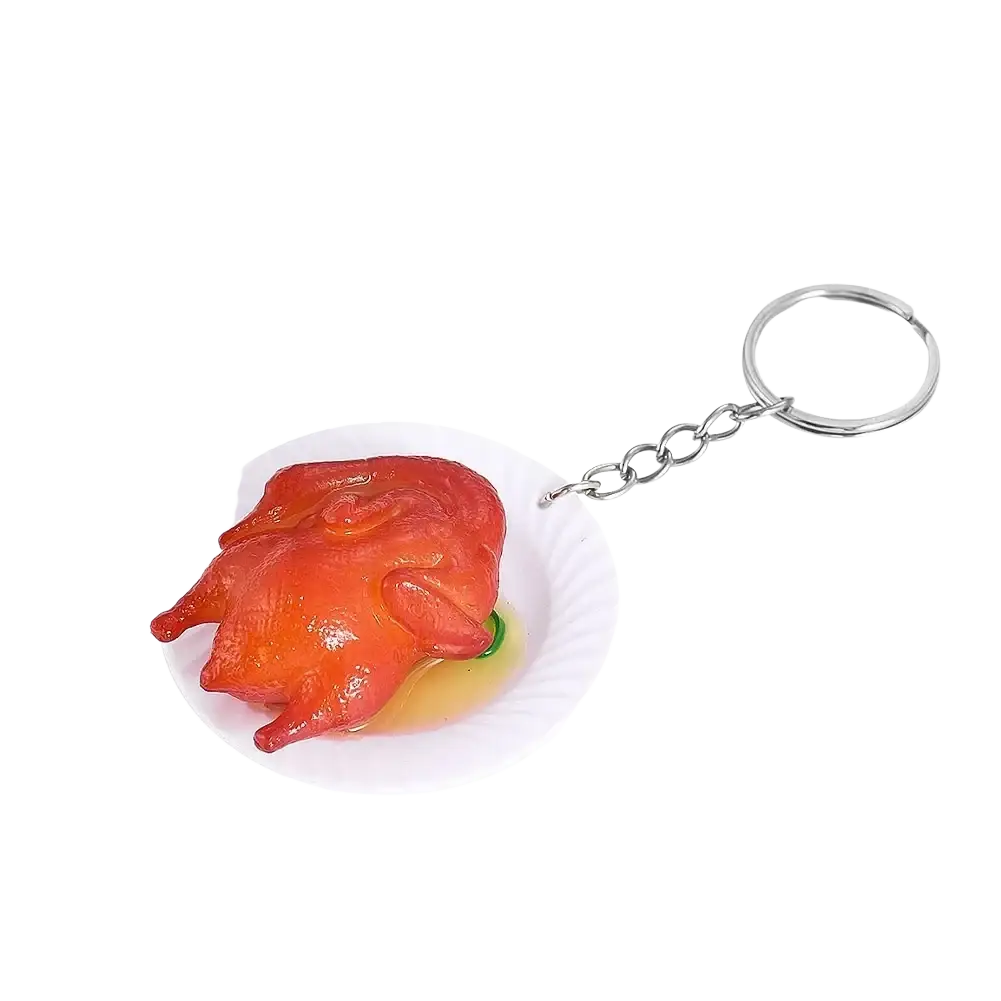 Glossy red roasted chicken miniature food keychain with white paper plate base and silver chain attachment
