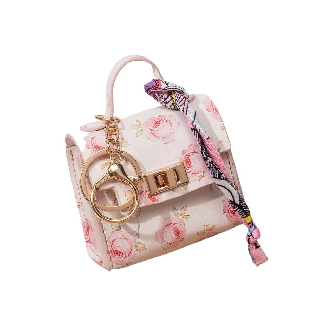 A delicate pink floral mini handbag keychain with gold-tone hardware and matching silk scarf accessory