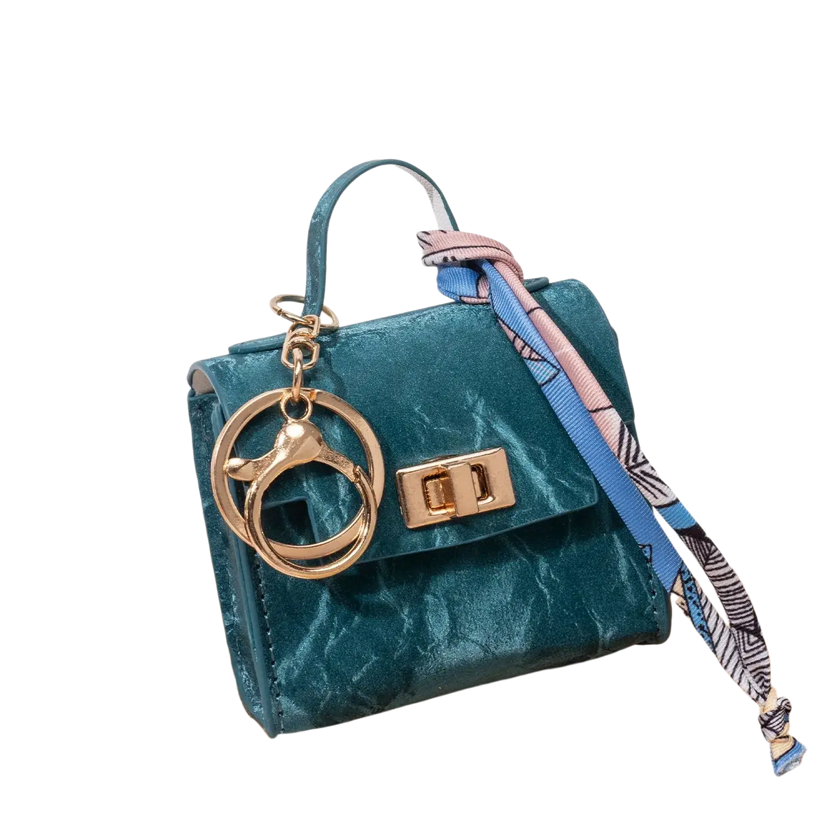 Teal velvet miniature handbag keychain with gold-tone hardware and patterned silk scarf tie accessory