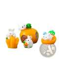 Miniature resin white rabbit figurines with black eyes and pink noses holding orange carrots for fairy garden decor