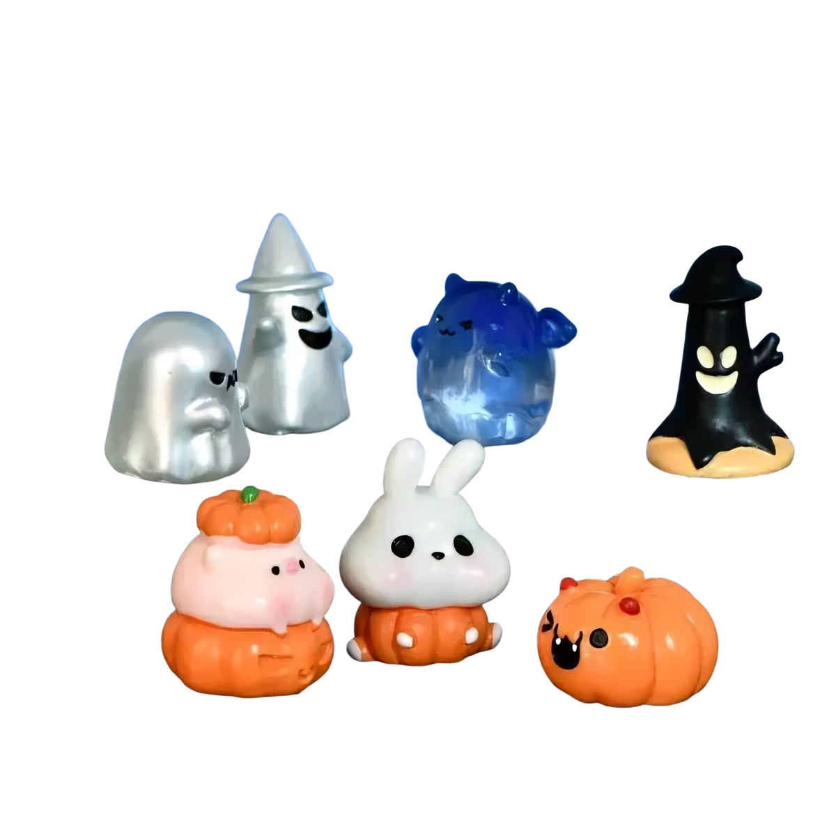 Miniature resin rabbit figurine with black eyes and white color sitting on an orange pumpkin base for fairy garden decor