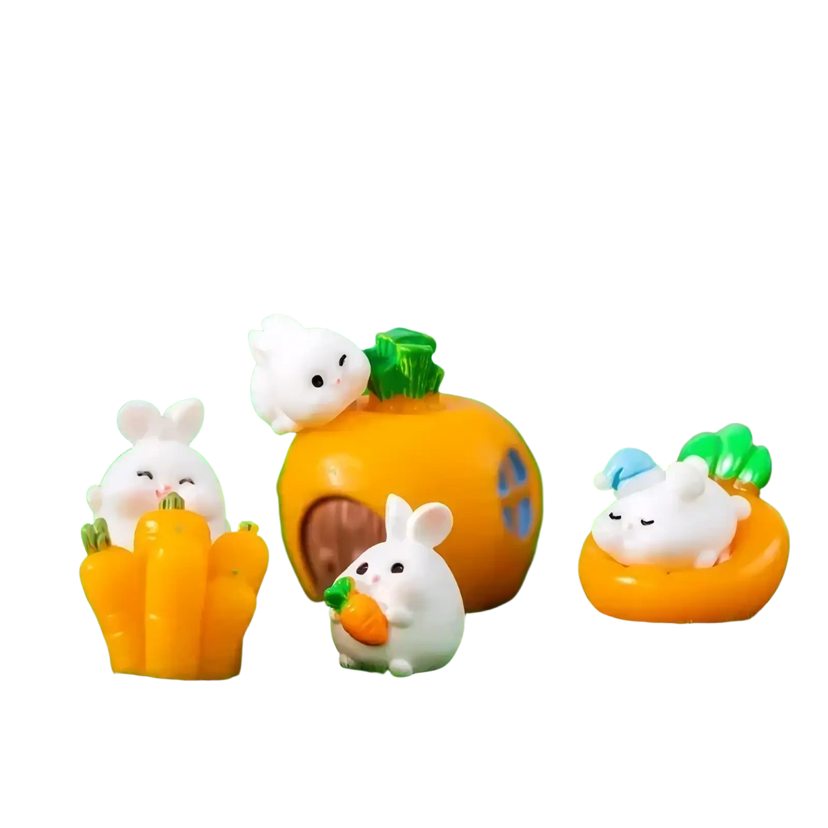 Miniature resin white rabbit figurines with black eyes and pink noses holding orange carrots for fairy garden decor