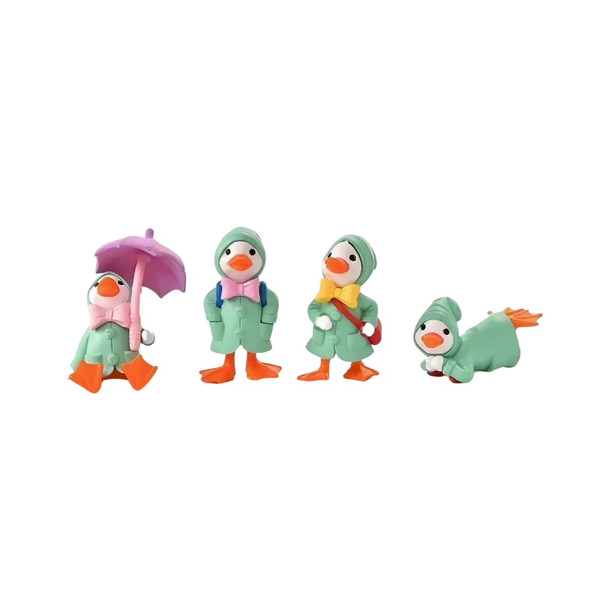 Set of four mint-green resin duck figurines in raincoats with orange feet and beaks for fairy garden decor