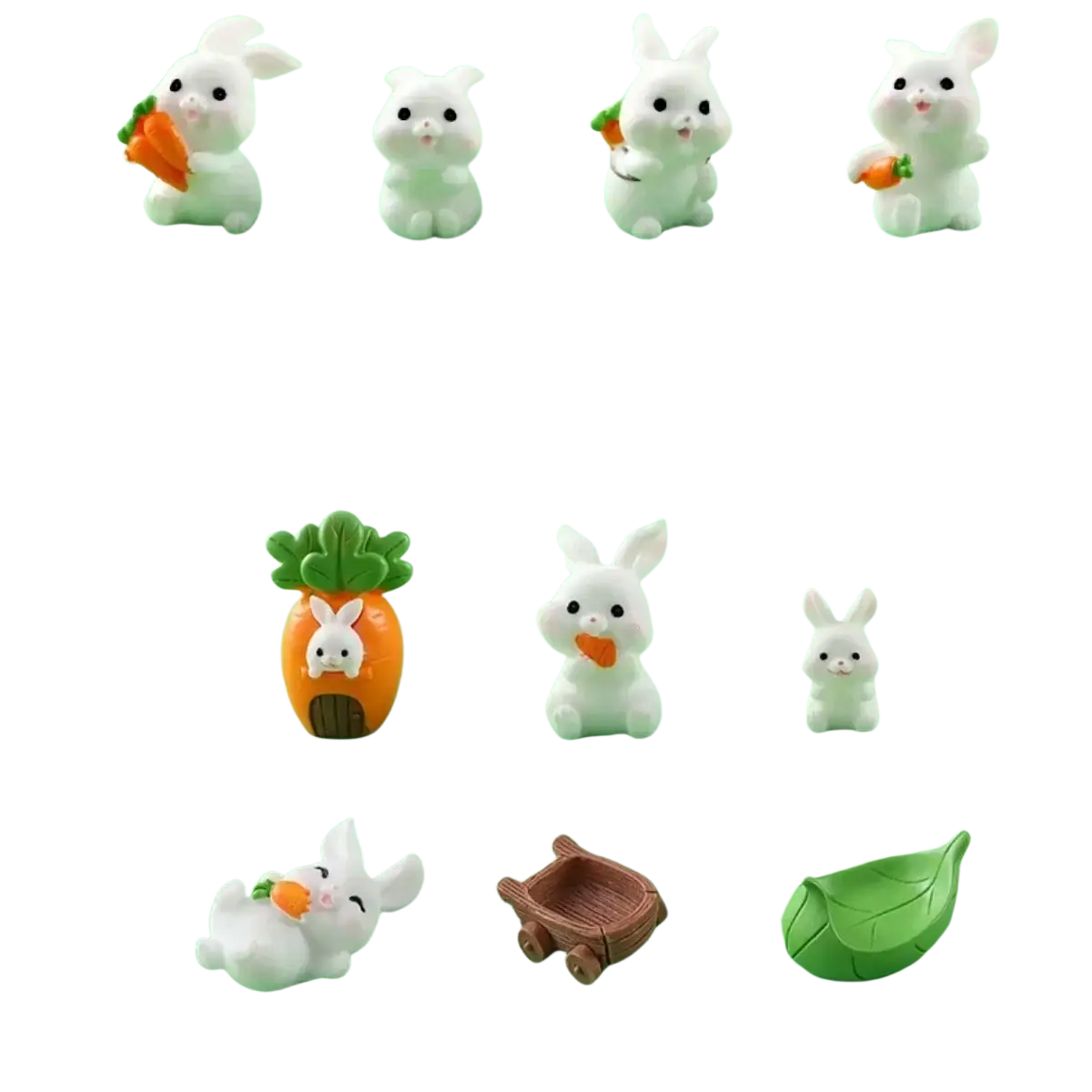 White plastic miniature resin rabbit figurines with some holding carrots and one inside a carrot-shaped house for fairy garden decor
