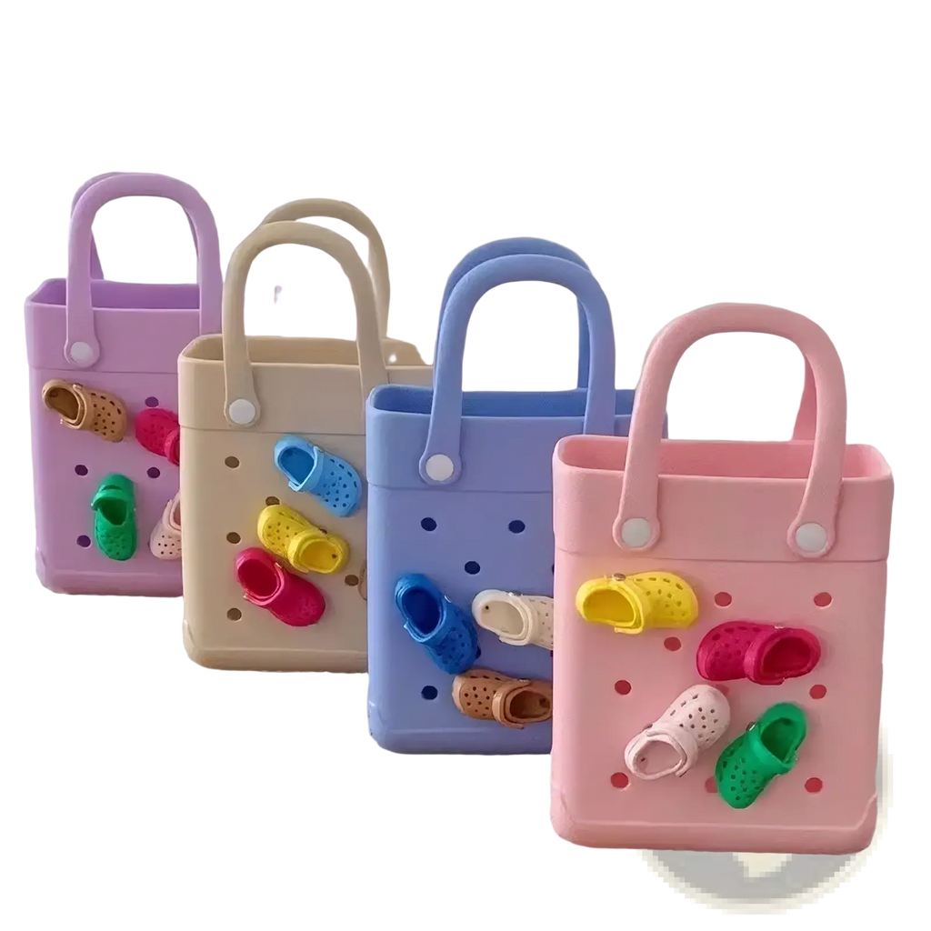 Pastel-colored plastic tote bags with perforated sides and handles, decorated with colorful miniature crocs shoe charms