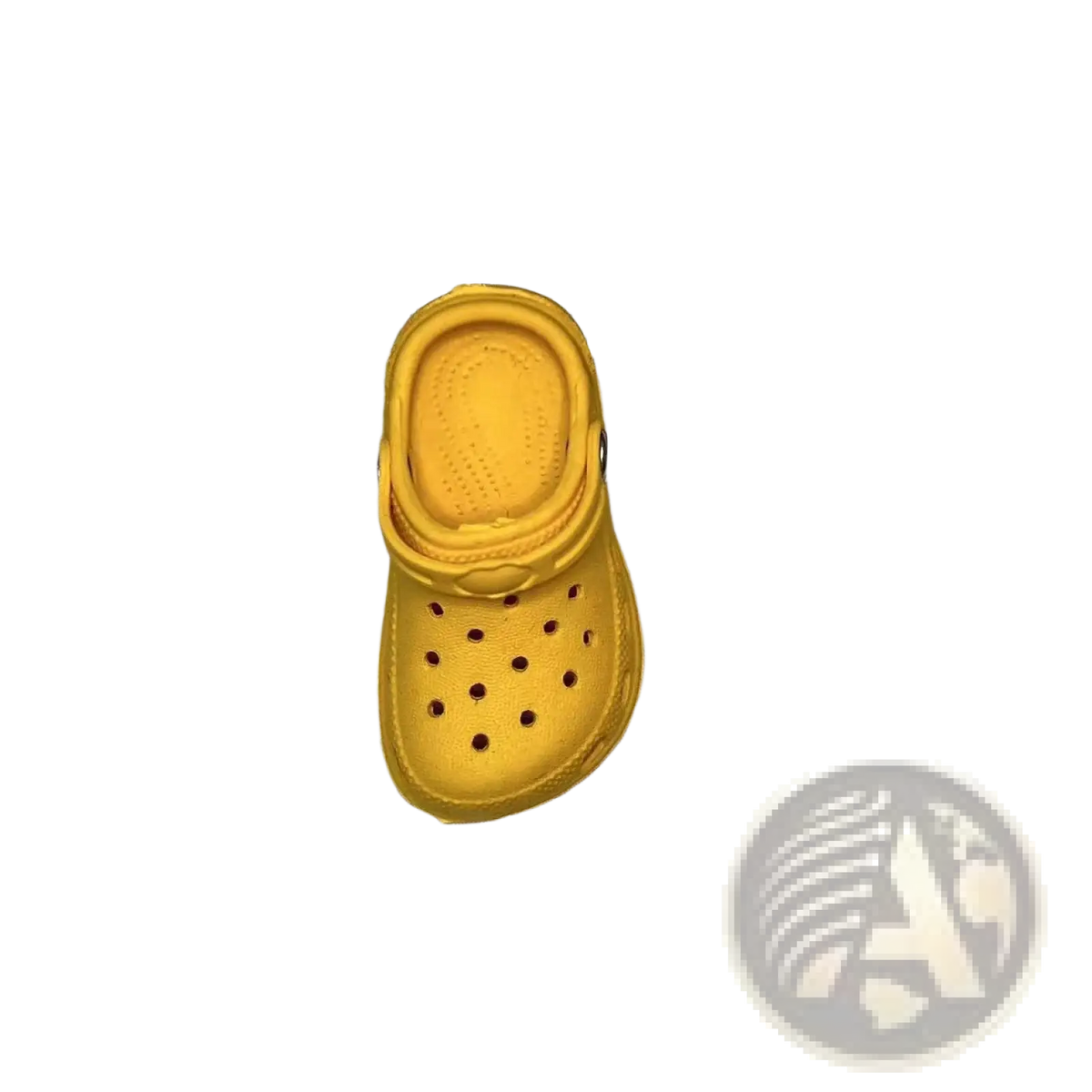 A bright yellow miniature crocs clog charm with classic perforated design and molded rubber sole for totes