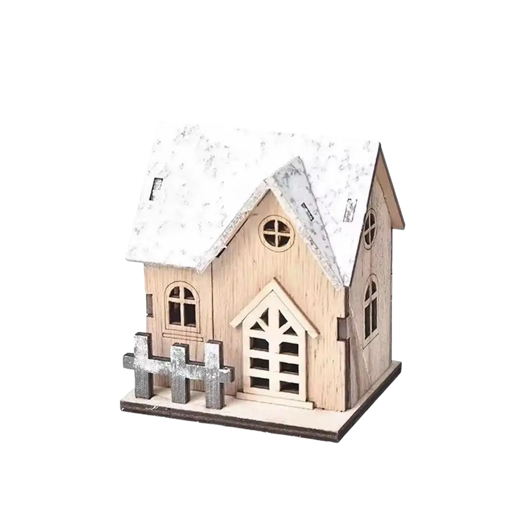Miniature wooden Christmas house with lights featuring a snow-dusted roof and gray picket fence, made of light wood