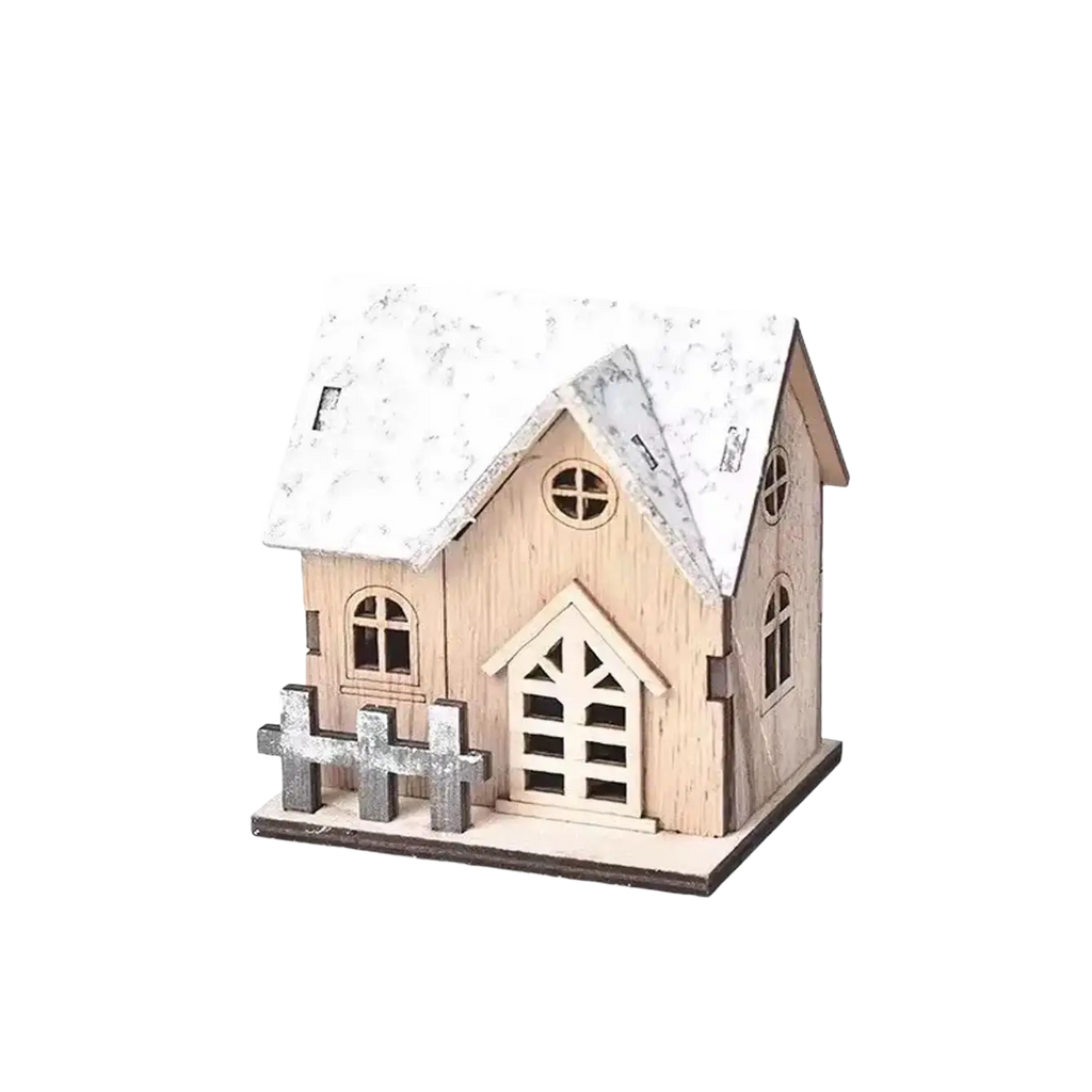 Miniature wooden Christmas house with lights featuring a snow-dusted roof and gray picket fence made of light wood