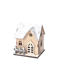 A rustic miniature wooden Christmas house with snow-dusted roof and gray picket fence made from light wood with lights