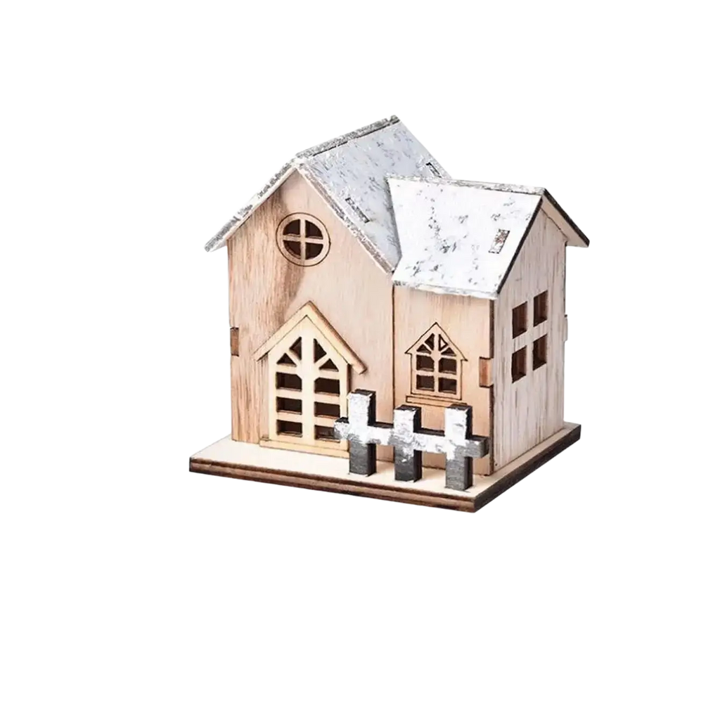 A miniature wooden Christmas house ornament with weathered white roof and fence crafted from light-colored wood