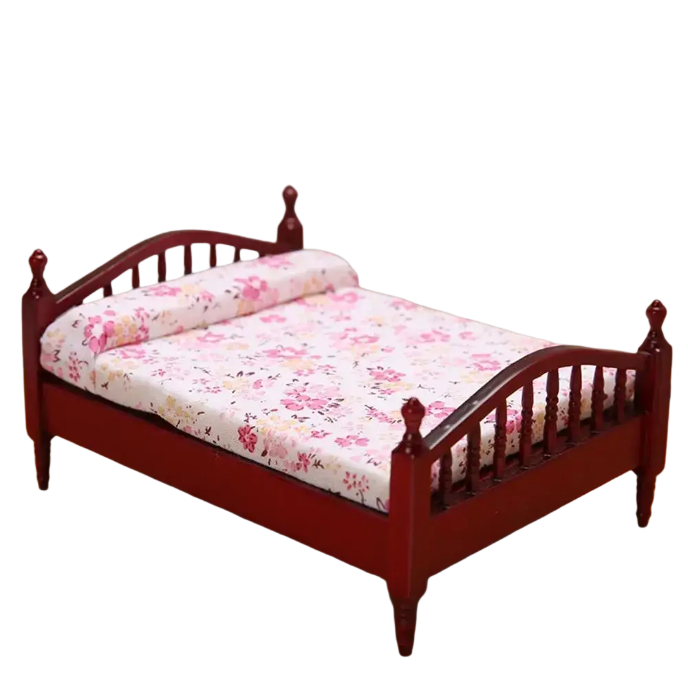 Miniature red wooden dollhouse bed with floral-patterned bedding for detailed dollhouse decor