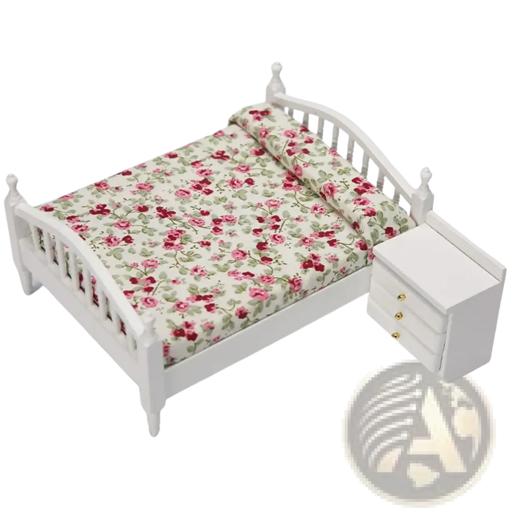 Miniature wooden dollhouse bed in white with a floral-patterned mattress featuring pink roses on cream background