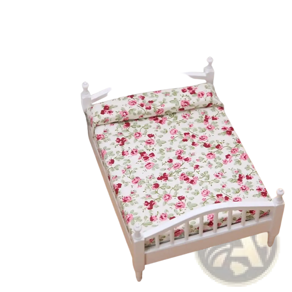 White miniature wooden dollhouse bed with pink and green floral bedding for decorative display