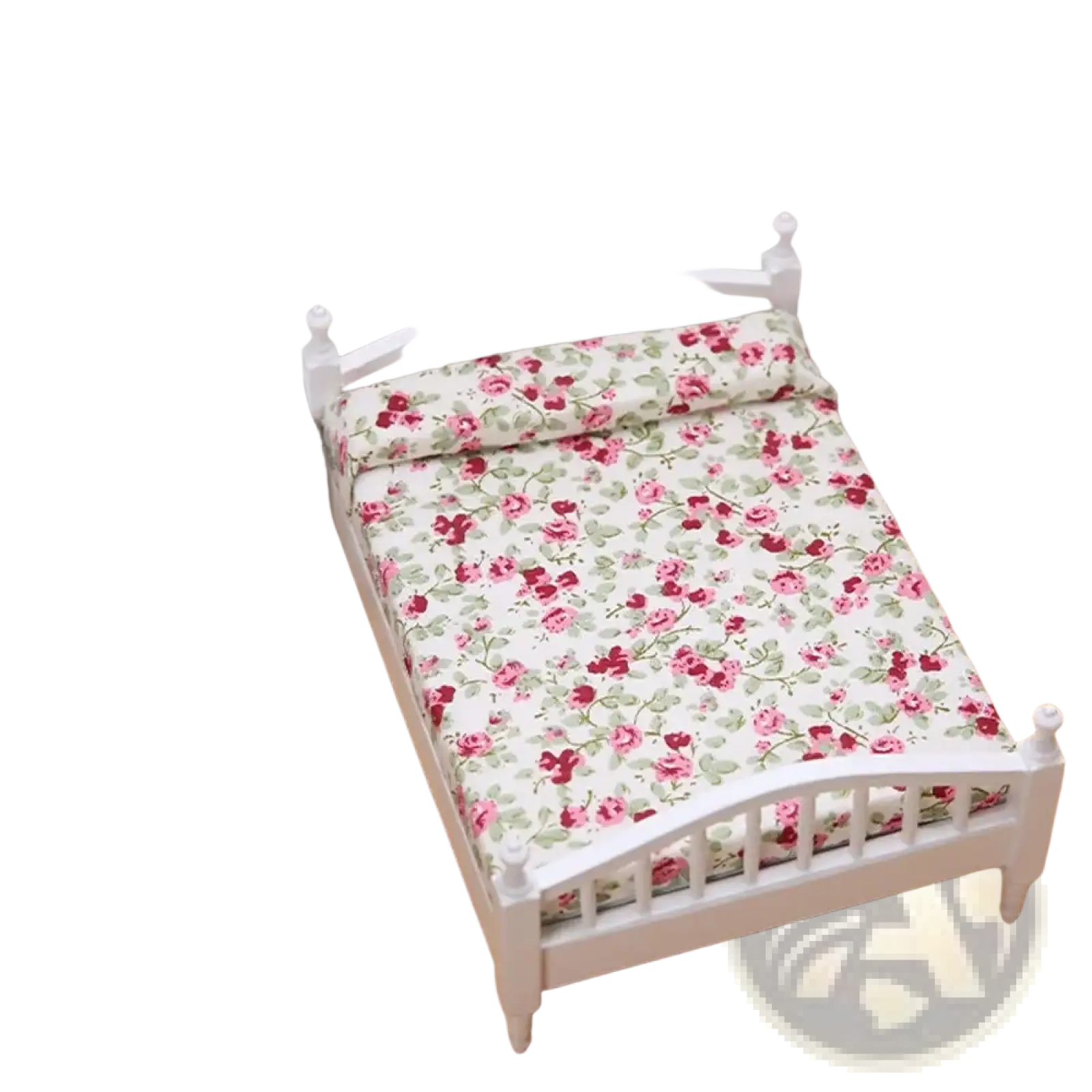 White miniature wooden dollhouse bed with pink and green floral bedding for decorative display