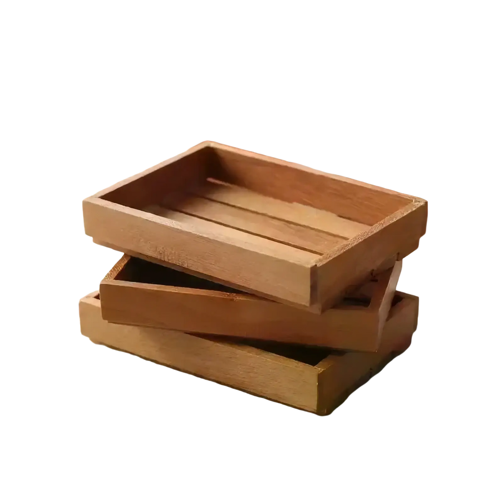 Stacked light brown wooden trays with a rustic slatted design in a miniature wooden dollhouse storage crate set