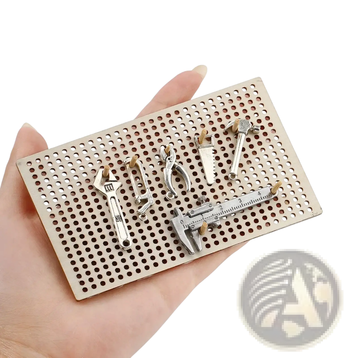 Silver-toned miniature wooden workbench tool set diy model kit displayed on perforated metal board background