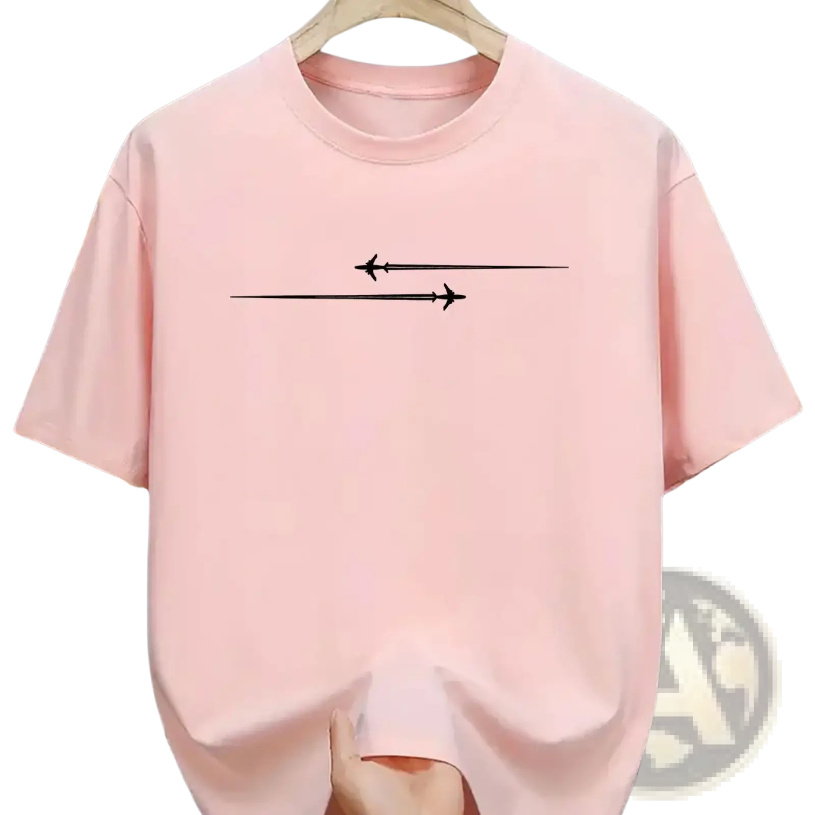 A soft pink minimalist airplane graphic cotton blend sport t shirt with short sleeves featuring two black planes