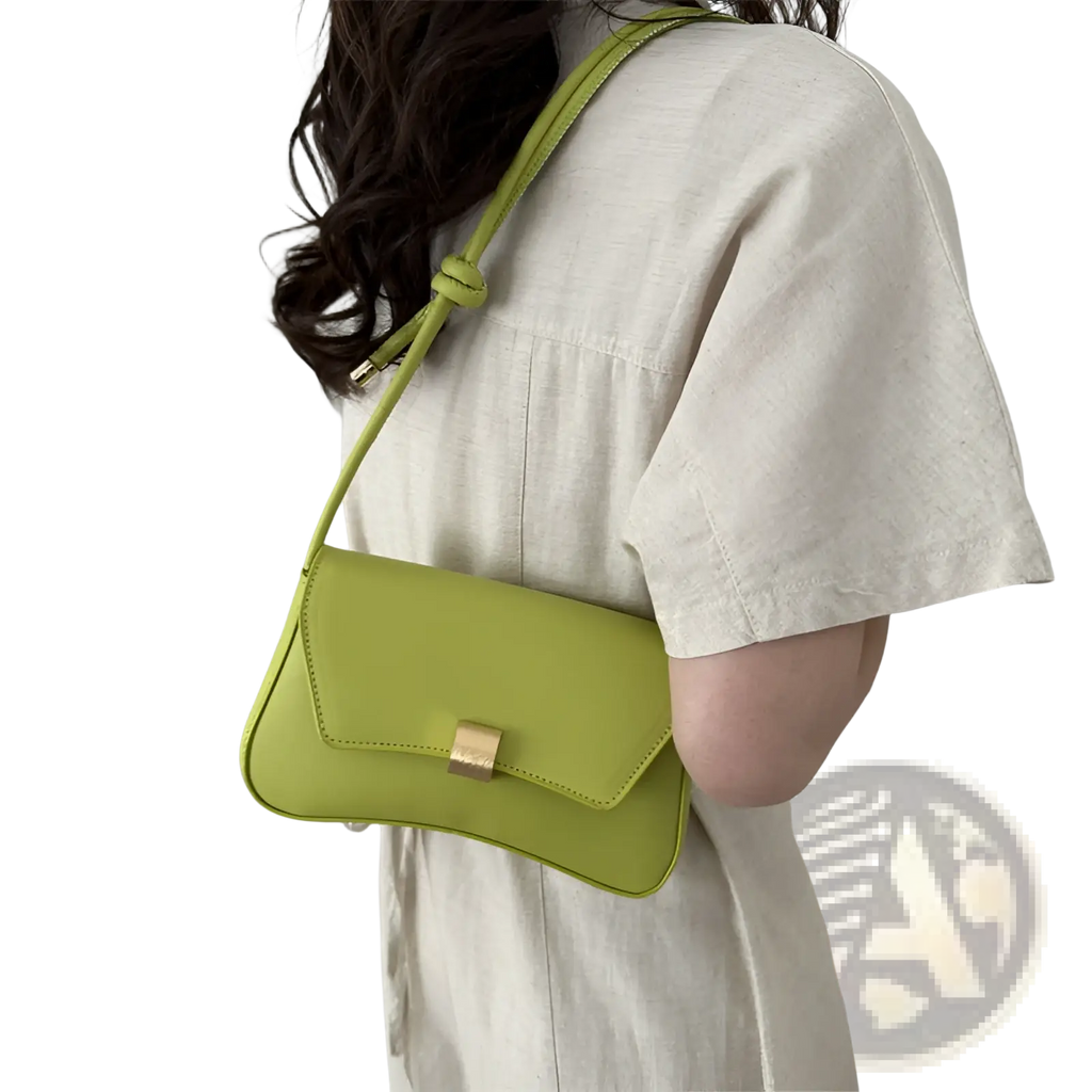 A sleek lime green minimalist faux leather crossbody bag with structured design and gold-tone hardware