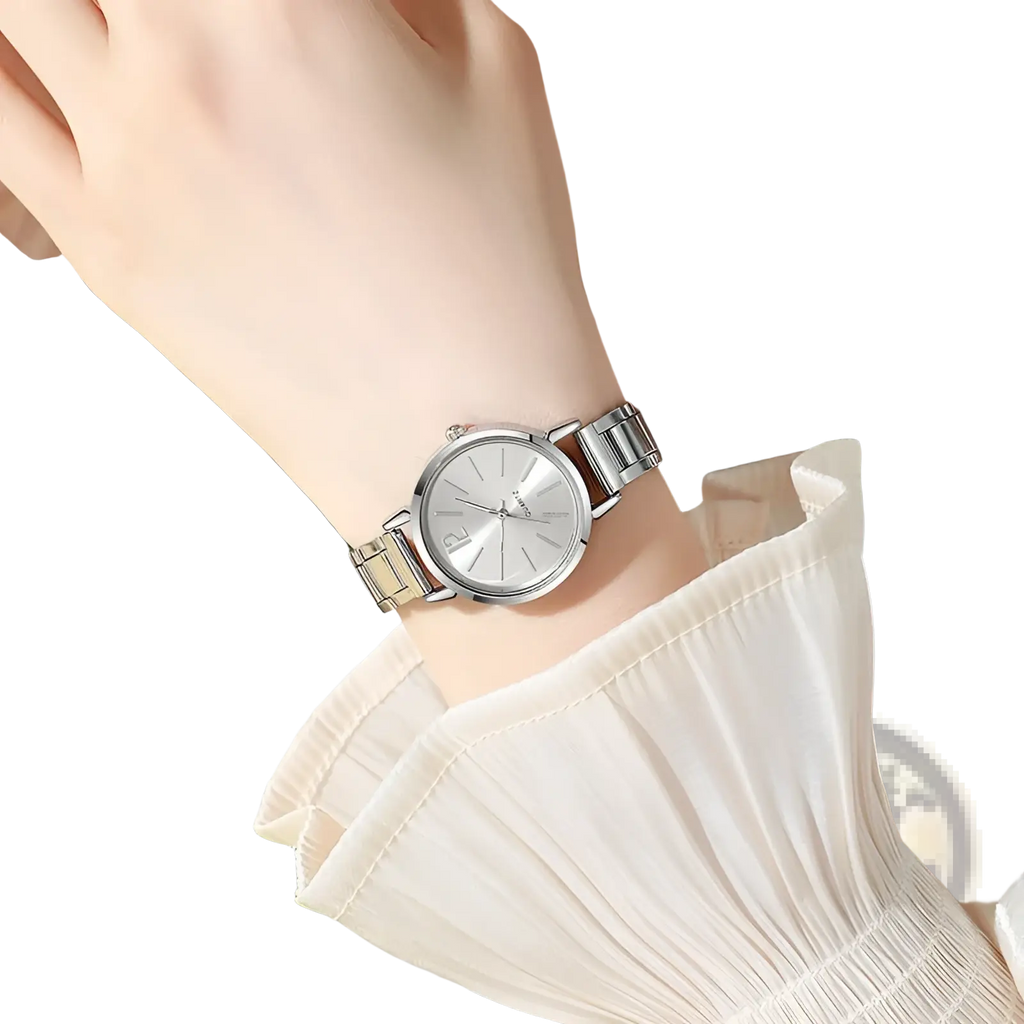Minimalist gold women quartz wristwatch with silver-toned stainless steel case and slender hands worn on a wrist