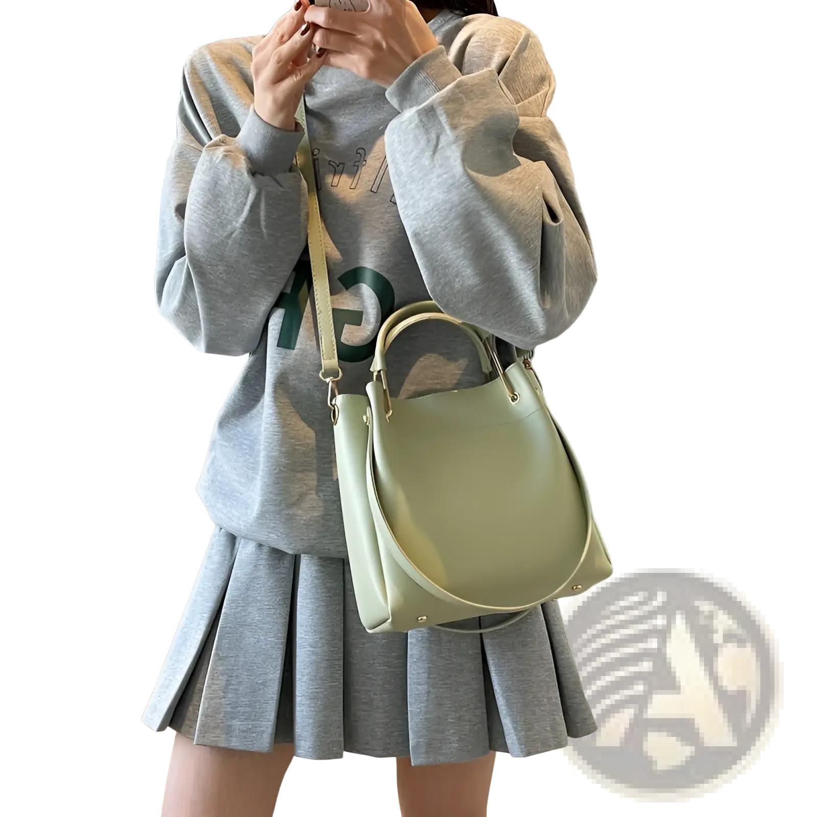 Minimalist mint green leather bucket bag with top handles and detachable shoulder strap for versatile use