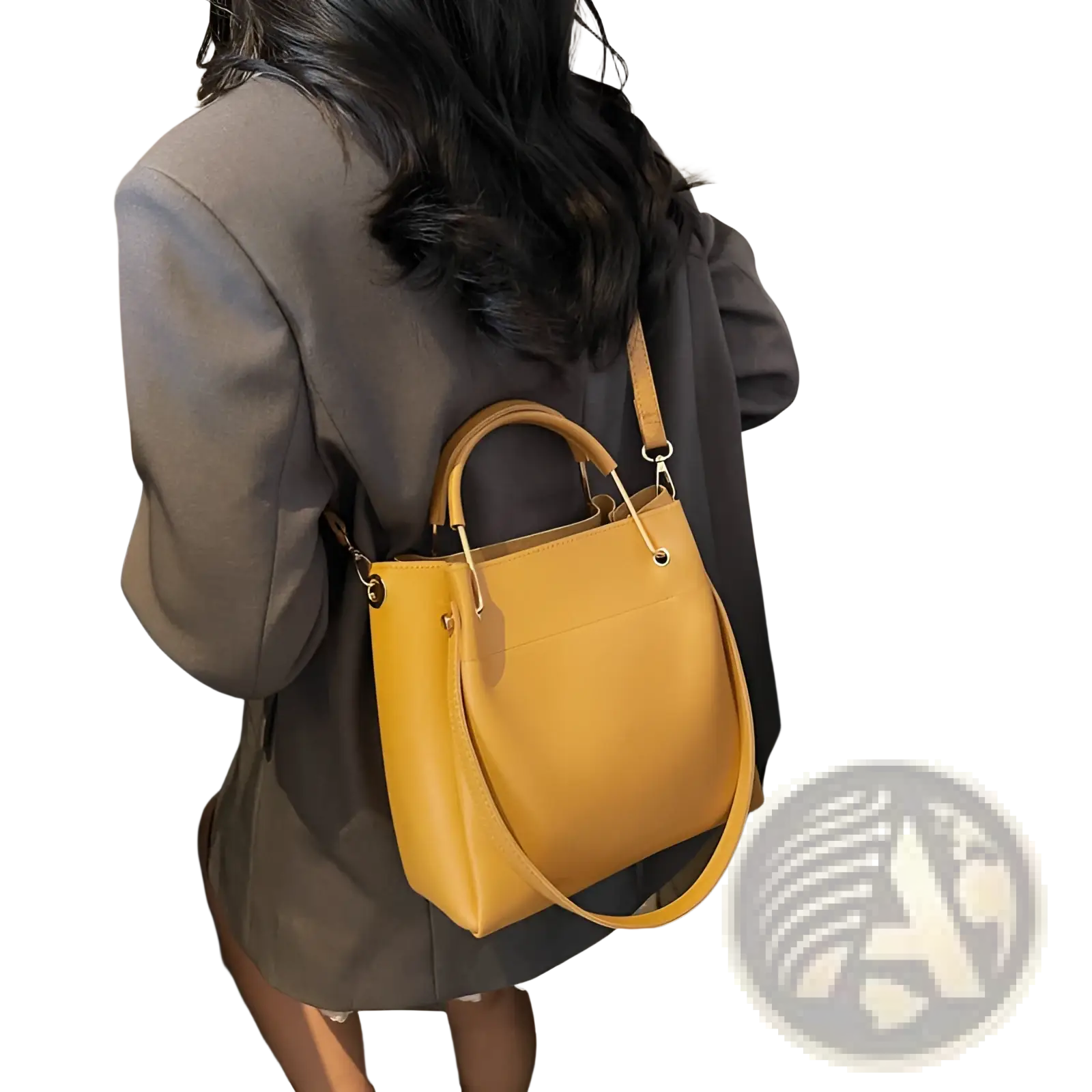 A mustard yellow minimalist leather bucket bag with top handle and detachable shoulder strap